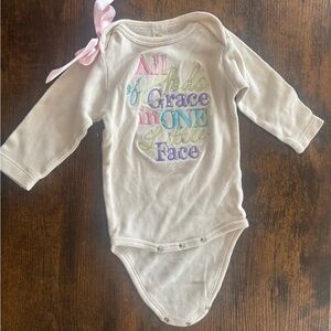 Cream Long Sleeve Baby Onesie with Pastel Print